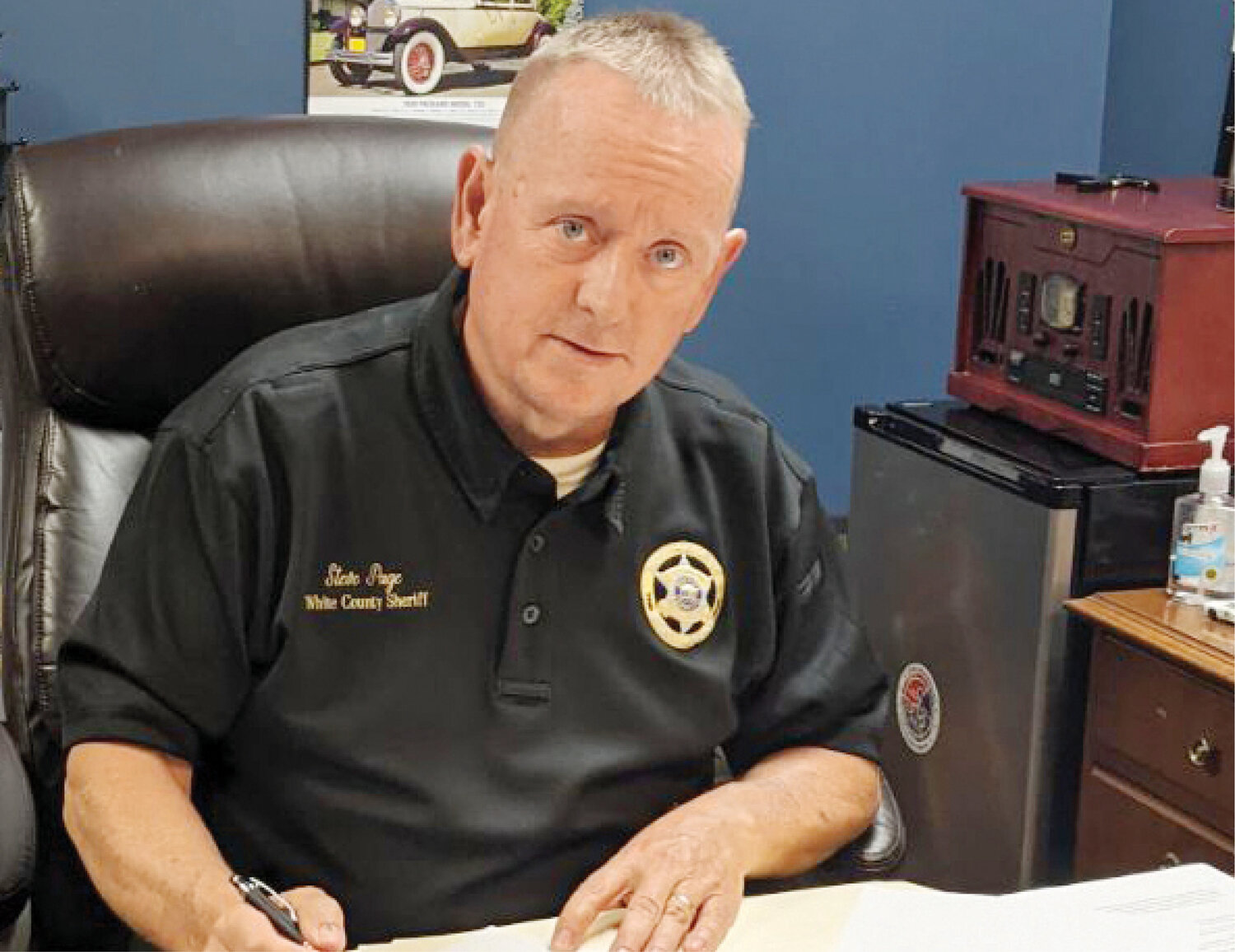 White County Sheriff Steve Page signs the paperwork that will implement a new program for inmates.